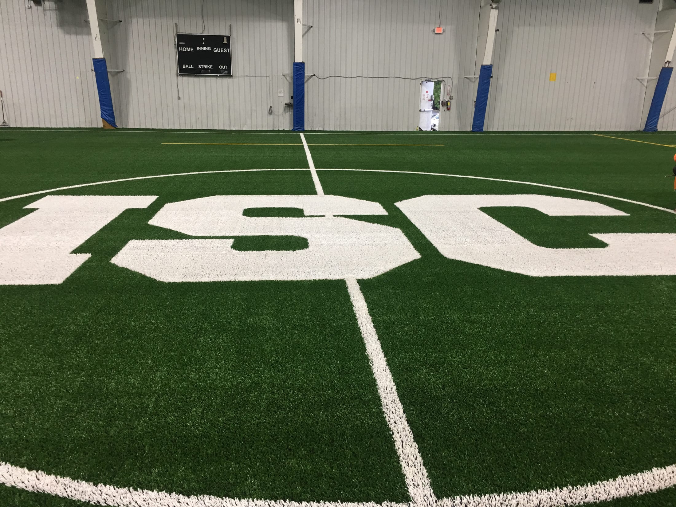 Irondequoit Sports Center logo at midfield